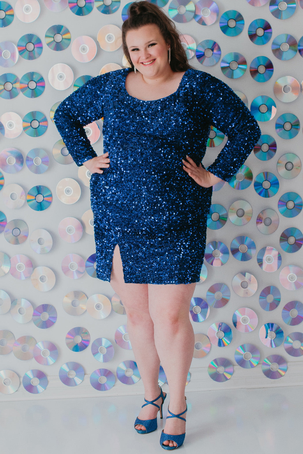 Sydney's Closet Style SC8113 plus size sequin party dress with long sleeves, scoop nekcline and slit. Available in blue, red, black and forest green.