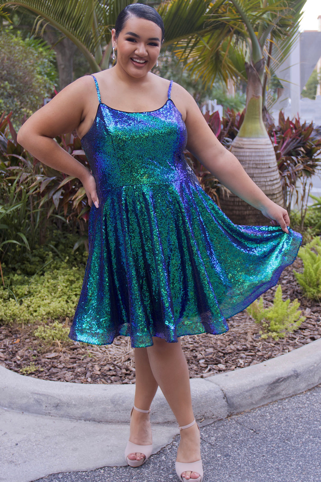 This is SC8122 in our Sydney's Closet Homecoming collection. This plus size party dress comes in white, red, blue, light blue, green, and purple! This dress has straps covered in sequins, a scoop neckline, and a natural waistline. This a-line all over sequins dress has a horsehair hem so that you can dance the night away! To make it even more spectacular, we have added pockets to make this the perfect dress for homecoming season!