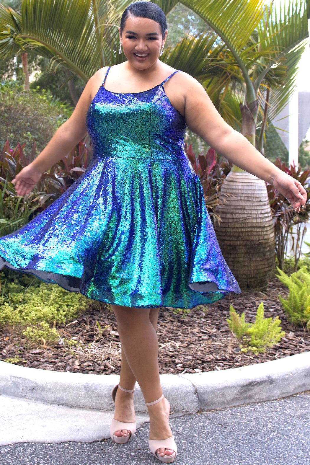 This is SC8122 in our Sydney's Closet Homecoming collection. This plus size party dress comes in white, red, blue, light blue, green, and purple! This dress has straps covered in sequins, a scoop neckline, and a natural waistline. This a-line all over sequins dress has a horsehair hem so that you can dance the night away! To make it even more spectacular, we have added pockets to make this the perfect dress for homecoming season!