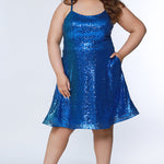 This is SC8122 in our Sydney's Closet Homecoming collection. This plus size party dress comes in white, red, blue, light blue, green, and purple! This dress has straps covered in sequins, a scoop neckline, and a natural waistline. This a-line all over sequins dress has a horsehair hem so that you can dance the night away! To make it even more spectacular, we have added pockets to make this the perfect dress for homecoming season!