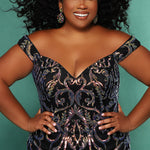 Tease Prom TE2105 Editorial Image of Plus Size mermaid dress with gold sequins with model's hands on hips smiling.