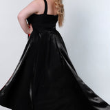 Tease Prom style number TE2204 Back viewBlack plus size fitted v-neck gown with black overskirt with a pop of fuscia on the underside of overskirt. 