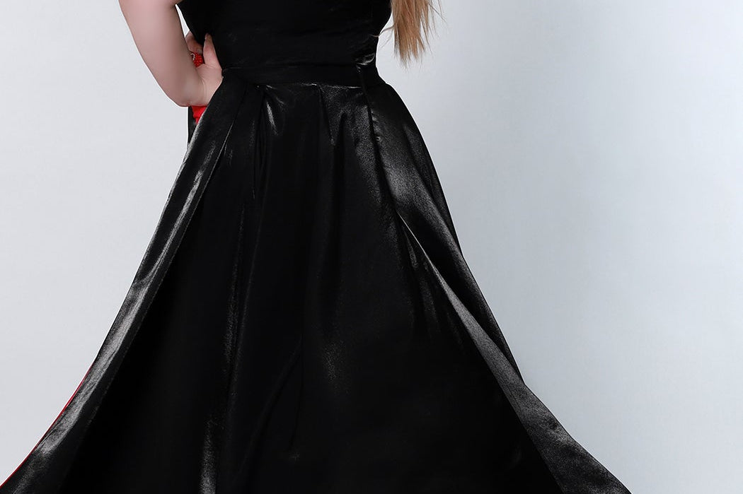 Tease Prom style number TE2204 Back viewBlack plus size fitted v-neck gown with black overskirt with a pop of fuscia on the underside of overskirt. 