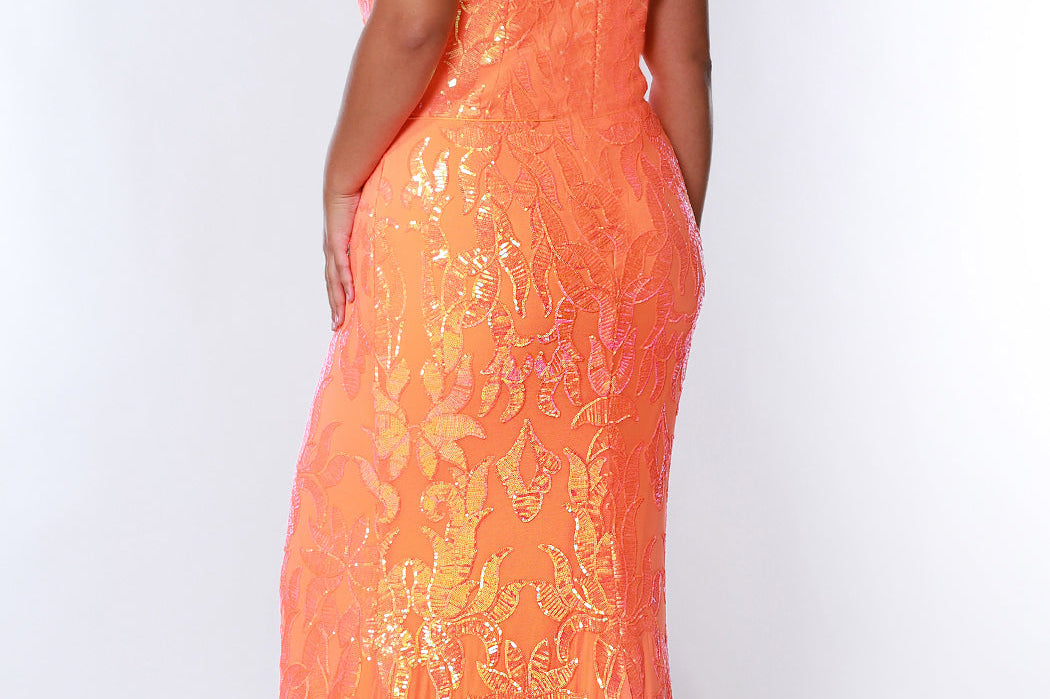 Tease Prom TE2307 Tangelo orange. Slim A-line silhouette with a scoop neckline and ½ inch straps covered in lace. Scoop back and a center back zipper. Sequins over stretch knit 5 inch train 2 inch horsehair hem.