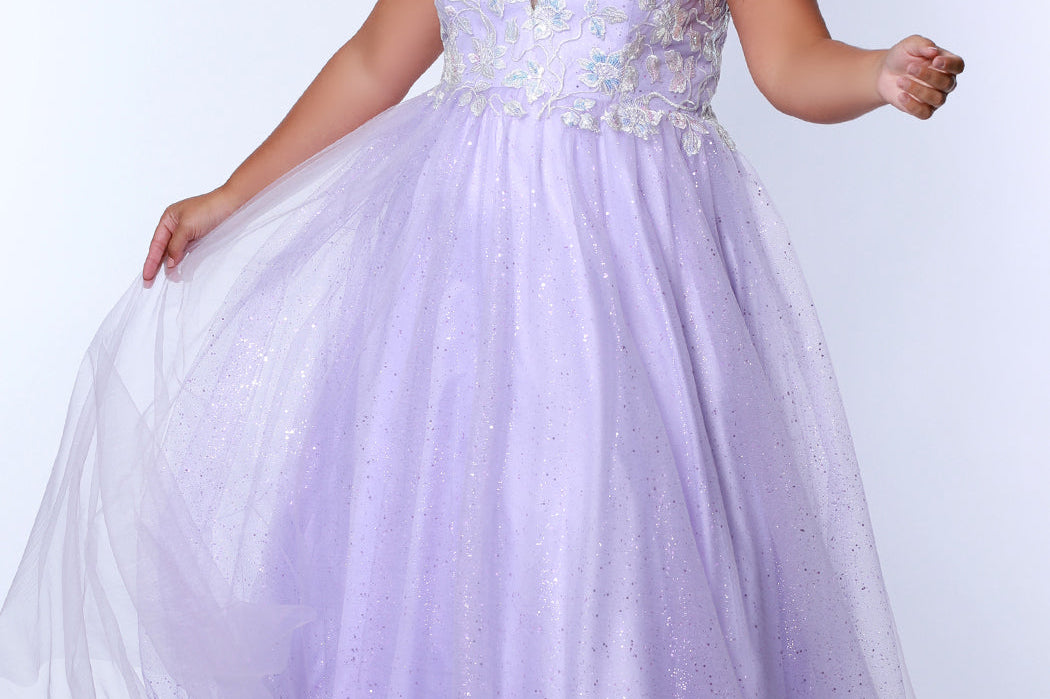 Tease Prom TE2315 light purple.  A-line silhouette, natural waistline  and V-neckline. Sparkle tulle and leaf lace appliques with sequins. Half inch straps covered in lace. Long invisible center back zipper and a detachable self belt. 