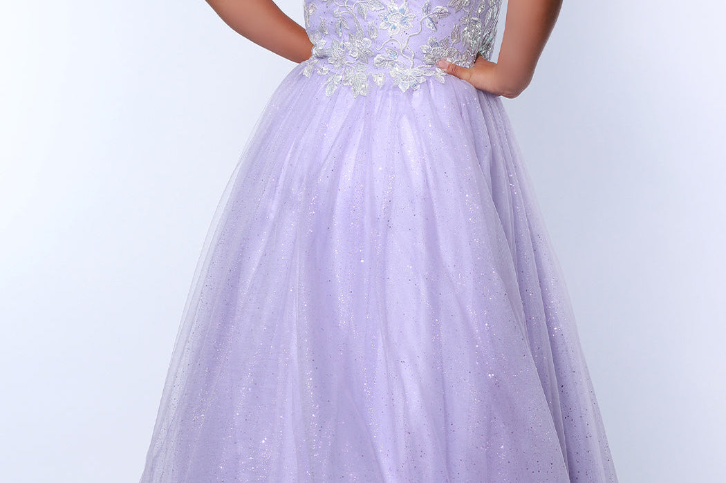 Tease Prom TE2315 light purple. A-line silhouette, natural waistline  and V-neckline. Sparkle tulle and leaf lace appliques with sequins. Half inch straps covered in lace. Long invisible center back zipper and a detachable self belt. 