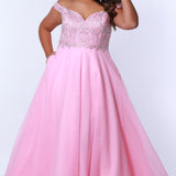 Tease Prom TE2317 Bubblegum pink. A-line silhouette with a natural waistline, V-neckline and V-back. Metallic lace over satin lining. Off-the-shoulder straps with elastic band, chiffon skirt with pockets and crinoline. Center back zipper. .