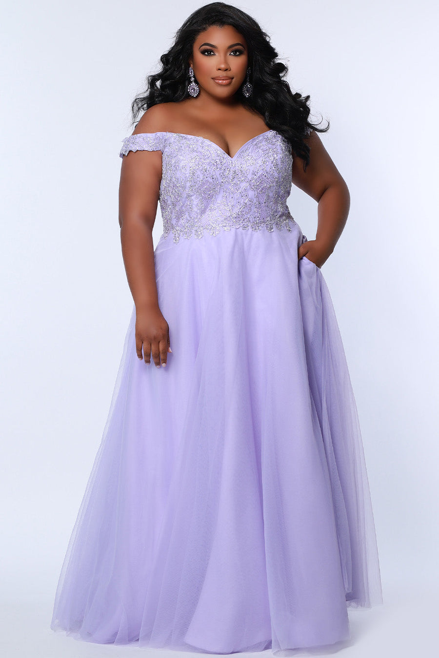 Tease Prom TE2317 Lavender purple.  A-line silhouette with a natural waistline, V-neckline and V-back. Metallic lace over satin lining. Off-the-shoulder straps with elastic band, chiffon skirt with pockets and crinoline. Center back zipper. .