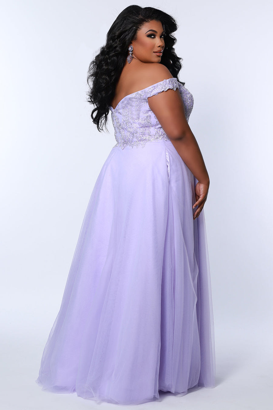 Tease Prom TE2317 Lavender purple. A-line silhouette with a natural waistline, V-neckline and V-back. Metallic lace over satin lining. Off-the-shoulder straps with elastic band, chiffon skirt with pockets and crinoline. Center back zipper. .