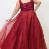 Tease Prom TE2323 Burgundy red. Ballgown silhouette with a full A-line tulle skirt. Natural waistline and a sweetheart neckline and bra-friendly straps. Heavily beaded bodice with tone-on-tone beading on lace appliques. Embroidered lace and sparkle tulle skirt with pockets. Lace-up back with modesty panel. 