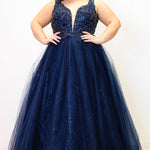 Tease Prom TE2323 Navy blue. Ballgown silhouette with a full A-line tulle skirt. Natural waistline and a sweetheart neckline and bra-friendly straps. Heavily beaded bodice with tone-on-tone beading on lace appliques. Embroidered lace and sparkle tulle skirt with pockets. Lace-up back with modesty panel. 