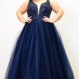 Tease Prom TE2323 Navy blue. Ballgown silhouette with a full A-line tulle skirt. Natural waistline and a sweetheart neckline and bra-friendly straps. Heavily beaded bodice with tone-on-tone beading on lace appliques. Embroidered lace and sparkle tulle skirt with pockets. Lace-up back with modesty panel. 