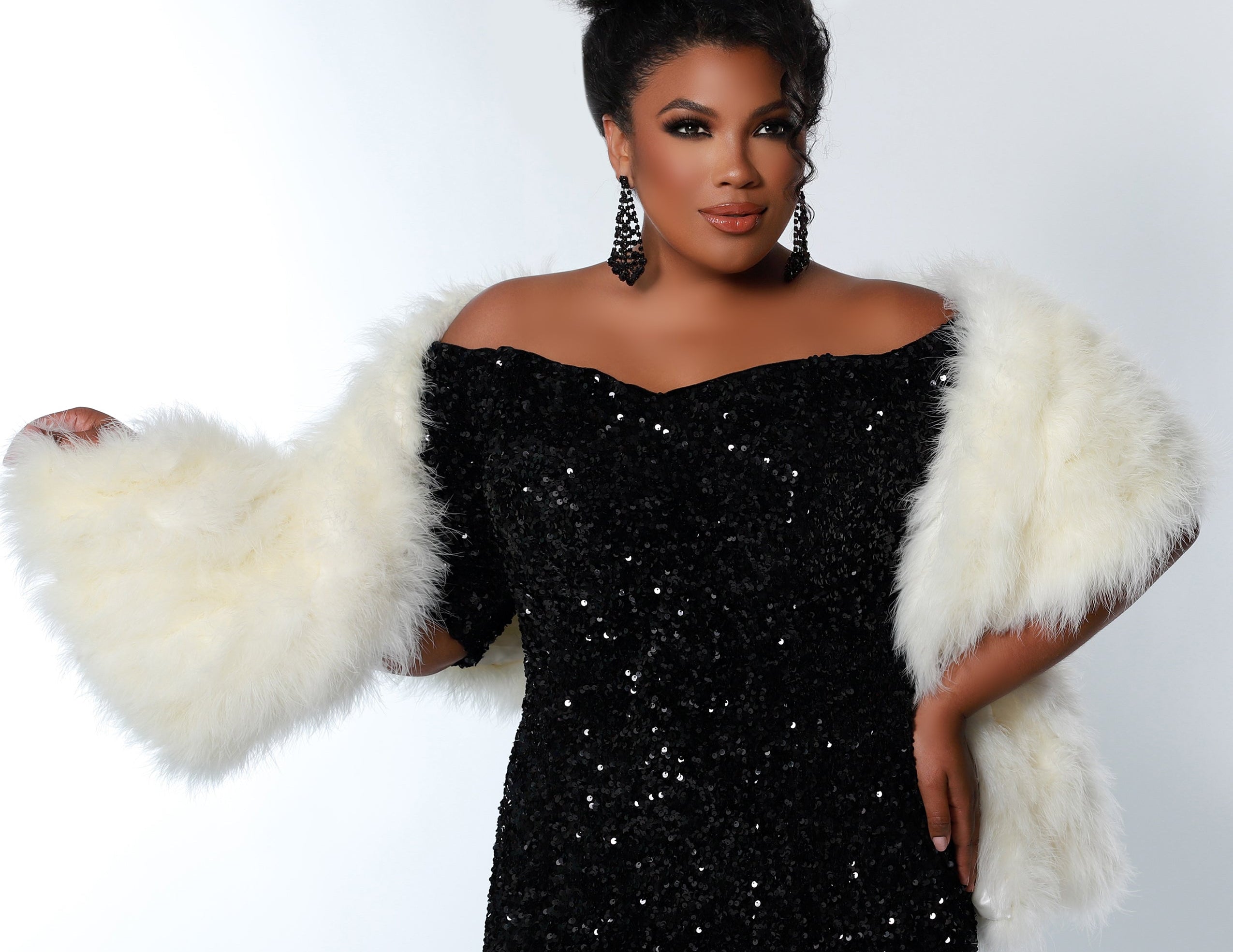 Best seller! Johnathan Kayne for Sydney's Closet plus size pageant, prom, evening, mother of the bride or groom formal gown.  Off-the-shoulder sleeves and fitted silhouette made in vibrant stretch sequins. Style JK2208. Photographer Georgina Vaughan